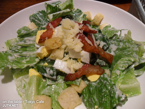 Caesar Salad with Bacon and Croutons - on the table
